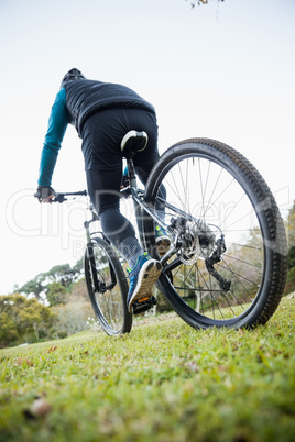 Male mountain biker riding bicycle