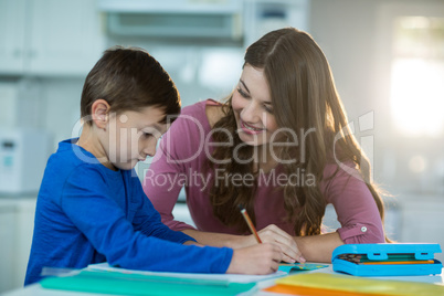 Mother helping her son with homework