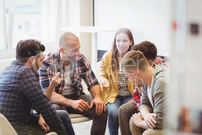 Creative business people sitting in meeting room