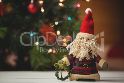 Close-up of santa claus on wooden table