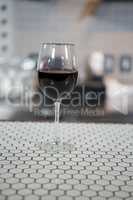 Glass of red wine on counter