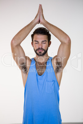 Man in lotus pose with eyes closed