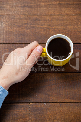 Man holding a cup of coffee