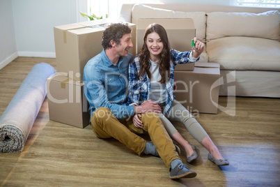 Couple holding the key of new home