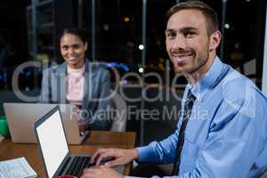 Businessman and businesswoman working in office