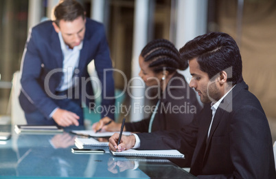 Businessman interacting with coworkers in a meeting in the conference room