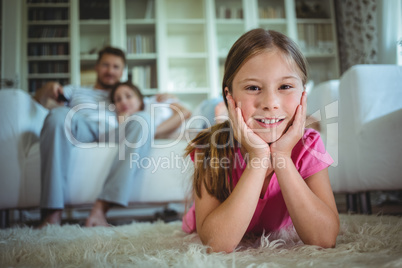 Happy girl lying on the floor