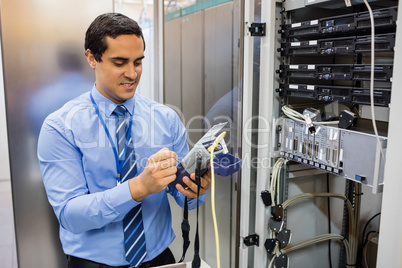 Technician using digital cable analyzer