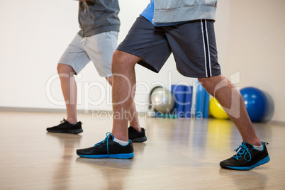 Men performing stretching exercise