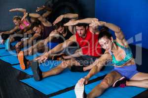 Young athletes doing stretching exercise