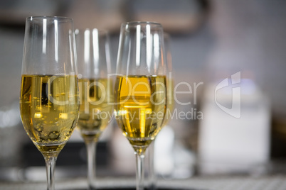 Three glass of champagne on bar counter