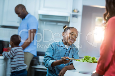 Girl smiling while preparing food