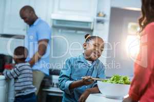 Girl smiling while preparing food