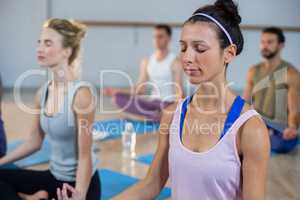 Two beautiful women performing yoga