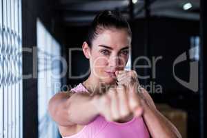 Portrait of confident athlete punching