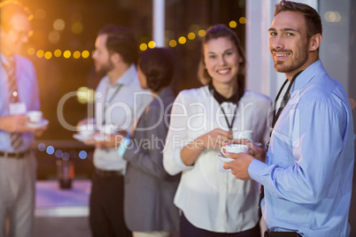 Businesspeople having coffee during break