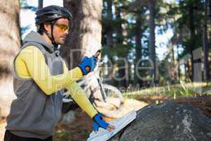 Mountain biker using mobile phone