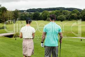 Couple standing on a golf course