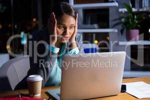 Businesswoman working on laptop