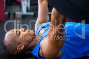 Male athlete exercising with barbell