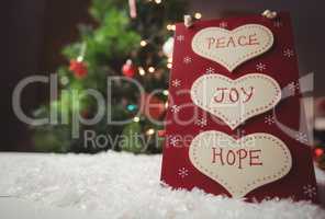 Christmas label with massages of peace, joy and hope