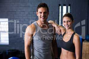 Happy male and female athlete in gym