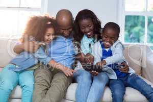 Family using mobile phone