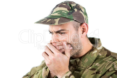 Soldier covering his mouth
