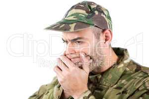 Soldier covering his mouth