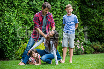 Happy family having fun in park