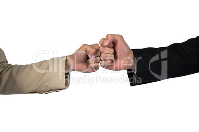 Business people giving fist bump