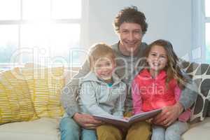 Family reading a book