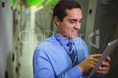 Technician using digital tablet in hallway