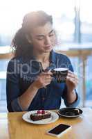 Woman having a cup of coffee in cafÃ?Â©