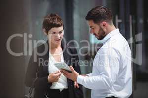 Businesspeople using digital tablet