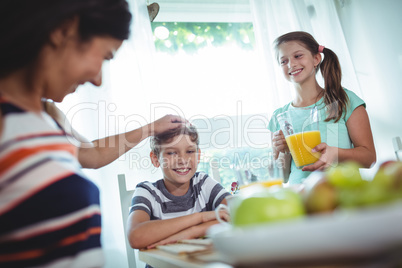 Smiling family having a breakfast