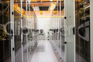 Hallway with a row of servers