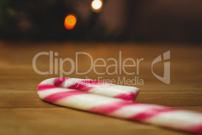 Candy cane on wooden table