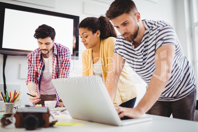 Coworkers working in meeting at creative office