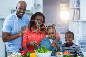 Happy family preparing food