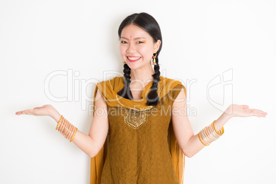 Mixed race Indian woman showing something