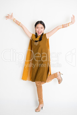 Excited Indian Chinese female arms raised