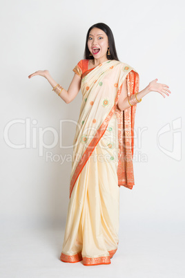 Shocked woman in Indian sari dress