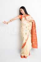 Woman in Indian sari dress dancing