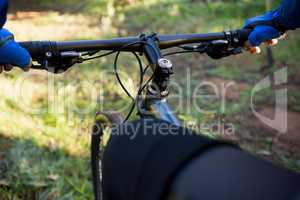 Close-up of male mountain biker riding bicycle