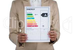 Businesswoman holding graph chart against white background
