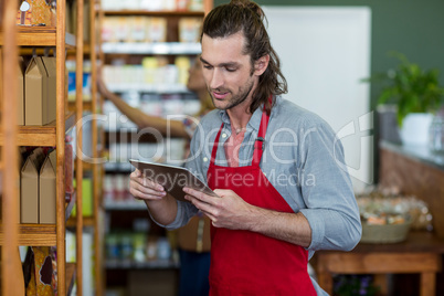 Male staff using a digital tablet