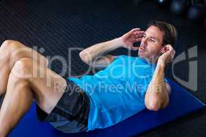 Young male athlete exercising