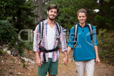 Portrait of hiker couple hiking in forest