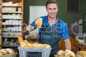 Portrait of male staff working at bakery store